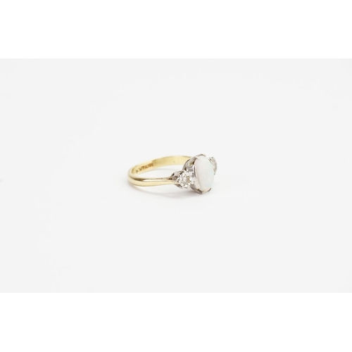 84 - A 18ct Gold & Platinum set Diamond and Opal Ring. Diamond size: 0.05ct each. Opal size: 1ct. Ring Si... 