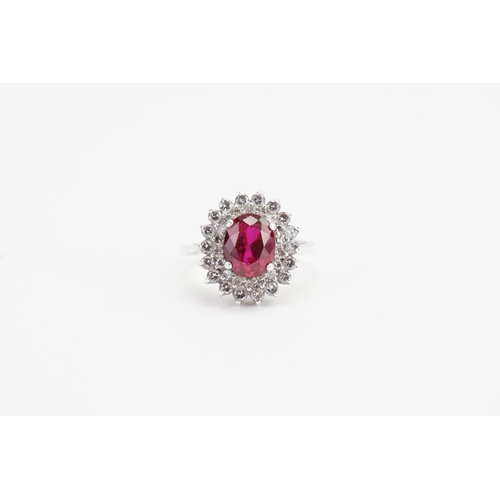 179 - A Fired Ruby set in a Silver mount with Paste Stones. Ruby size: 1.9ct approx. Ring size: Q. Weight:... 