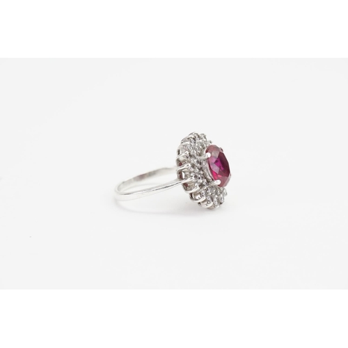 179 - A Fired Ruby set in a Silver mount with Paste Stones. Ruby size: 1.9ct approx. Ring size: Q. Weight:... 