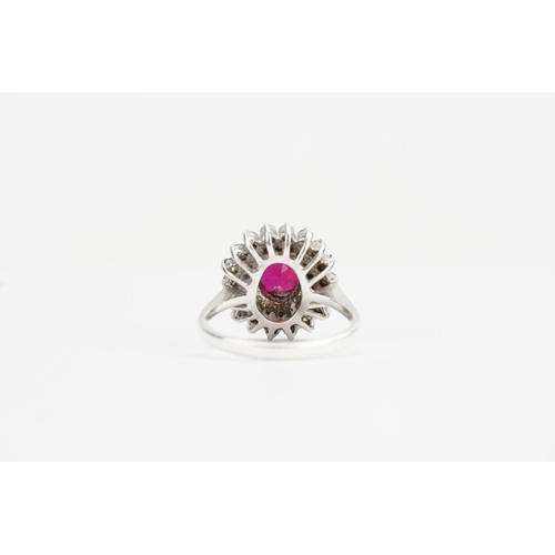 179 - A Fired Ruby set in a Silver mount with Paste Stones. Ruby size: 1.9ct approx. Ring size: Q. Weight:... 