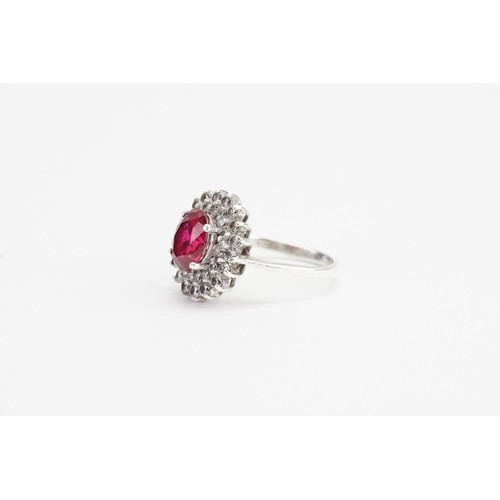 179 - A Fired Ruby set in a Silver mount with Paste Stones. Ruby size: 1.9ct approx. Ring size: Q. Weight:... 