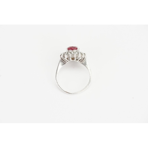 179 - A Fired Ruby set in a Silver mount with Paste Stones. Ruby size: 1.9ct approx. Ring size: Q. Weight:... 