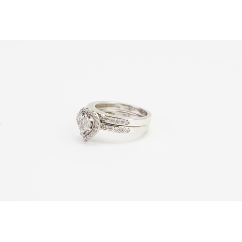 150 - A 14ct White Gold Diamond Wedding Band, set in a Love Heart Formation. Size N. Weight: 7.7 grams.