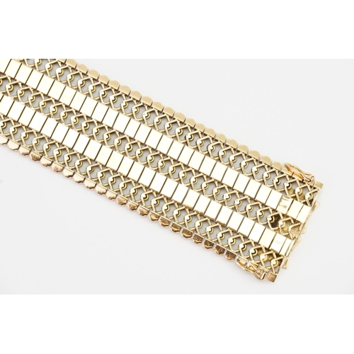 102 - A Chunky 18ct Gold Flexible Link Bracelet. Length: 18.5cms long x 3cms. Weight: 54 grams.