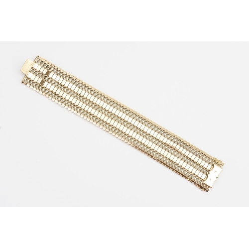 102 - A Chunky 18ct Gold Flexible Link Bracelet. Length: 18.5cms long x 3cms. Weight: 54 grams.