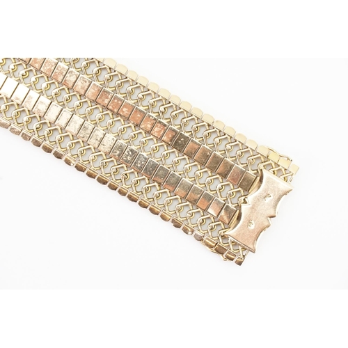 102 - A Chunky 18ct Gold Flexible Link Bracelet. Length: 18.5cms long x 3cms. Weight: 54 grams.