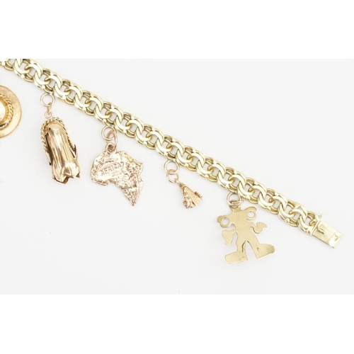 180 - A 14ct Gold Charm Bracelet to include an 18ct Gold Charm, 10ct Hat Charm and various other Charms. W... 