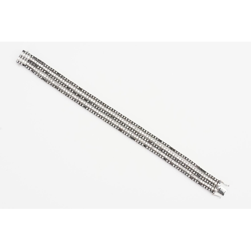 124 - A 14ct White Gold 5 Strand Diamond set Bracelet. Weight: 33.9 grams. Length: 17.5cms.