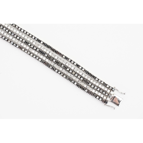 124 - A 14ct White Gold 5 Strand Diamond set Bracelet. Weight: 33.9 grams. Length: 17.5cms.