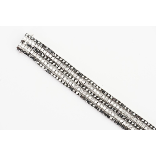 124 - A 14ct White Gold 5 Strand Diamond set Bracelet. Weight: 33.9 grams. Length: 17.5cms.