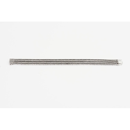 124 - A 14ct White Gold 5 Strand Diamond set Bracelet. Weight: 33.9 grams. Length: 17.5cms.