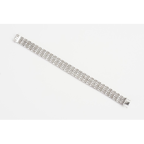 124 - A 14ct White Gold 5 Strand Diamond set Bracelet. Weight: 33.9 grams. Length: 17.5cms.