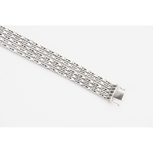 124 - A 14ct White Gold 5 Strand Diamond set Bracelet. Weight: 33.9 grams. Length: 17.5cms.