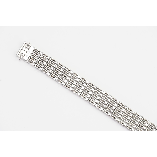 124 - A 14ct White Gold 5 Strand Diamond set Bracelet. Weight: 33.9 grams. Length: 17.5cms.