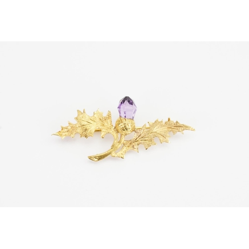 121 - A 9ct Gold Thistle Brooch set with an Acorn shaped Amethyst and safety chain. Weight: 3.7 grams.