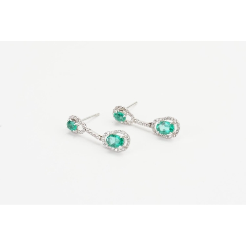 122 - A Pair of 14ct Gold, Emerald and Diamond Earrings in a drop design. Emerald size: 0.3ct. Weight: 3.1... 