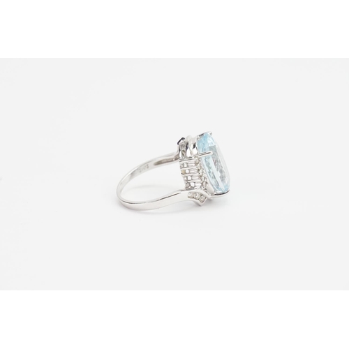 138 - A 14ct White Gold and Diamond set Aquamarine Ring cut in an Oval shape, set with 16 Diamonds. Aquama... 