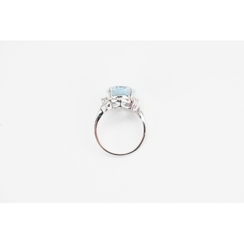 138 - A 14ct White Gold and Diamond set Aquamarine Ring cut in an Oval shape, set with 16 Diamonds. Aquama... 