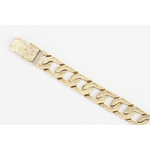 182 - A 9ct Gold Gentleman's etched Bracelet. Length: 20cms. Weight: 21.7 grams.