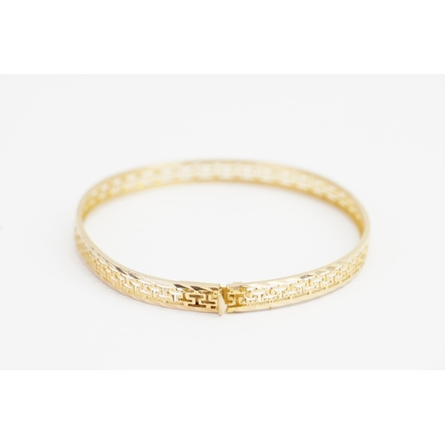 167 - A 14ct Gold Greek key design Bangle. Size: Diameter: 5.2cms x 6.3cms. Weight: 6.5 grams.