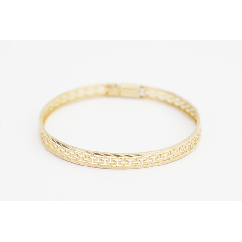 167 - A 14ct Gold Greek key design Bangle. Size: Diameter: 5.2cms x 6.3cms. Weight: 6.5 grams.