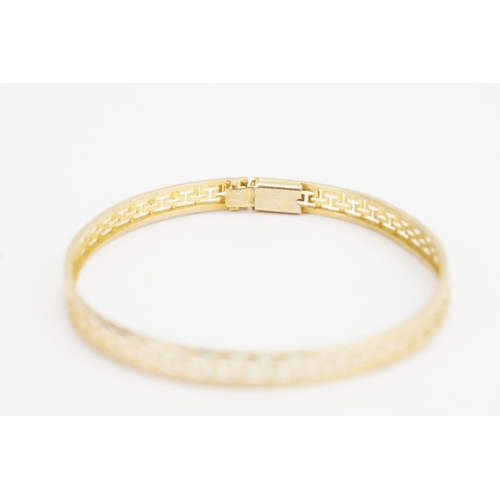 167 - A 14ct Gold Greek key design Bangle. Size: Diameter: 5.2cms x 6.3cms. Weight: 6.5 grams.