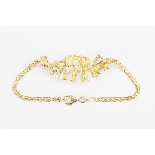 183 - An interesting 18ct Gold Bracelet designed with Safari animals. Weight: 8.6 grams. Length: 19cms.