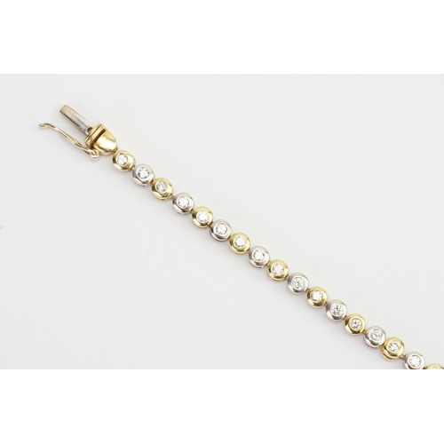 141 - An 18ct White & Yellow Gold Diamond set Tennis Bracelet set with 44 Diamonds. 0.03ct. Total: 1.32ct ... 