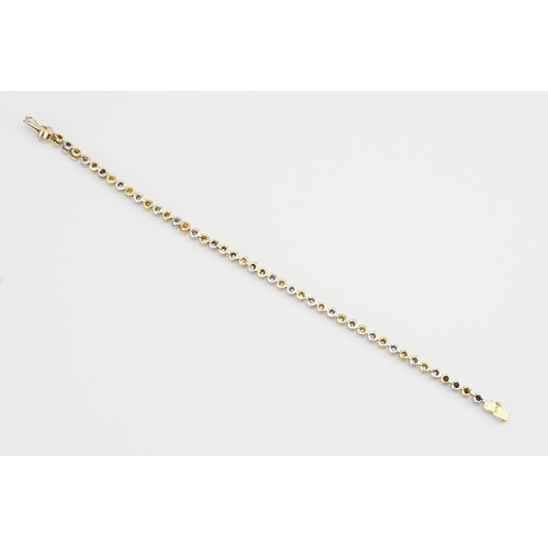 141 - An 18ct White & Yellow Gold Diamond set Tennis Bracelet set with 44 Diamonds. 0.03ct. Total: 1.32ct ... 