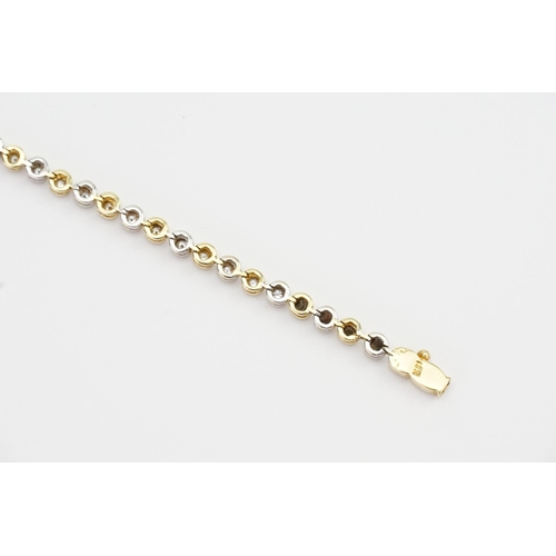 141 - An 18ct White & Yellow Gold Diamond set Tennis Bracelet set with 44 Diamonds. 0.03ct. Total: 1.32ct ... 