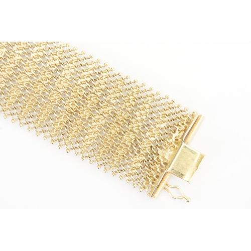 118 - A 18ct Gold Mesh design Bracelet. Weight: 60 grams. Length 17.5cms. Width: 3cms.