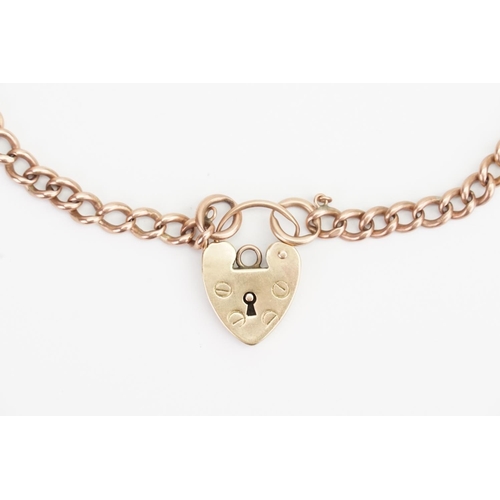 106 - An 9ct Gold Bracelet hung with a Love Heart Padlock. Length: 22.5cms. Weight: 14.6 grams.