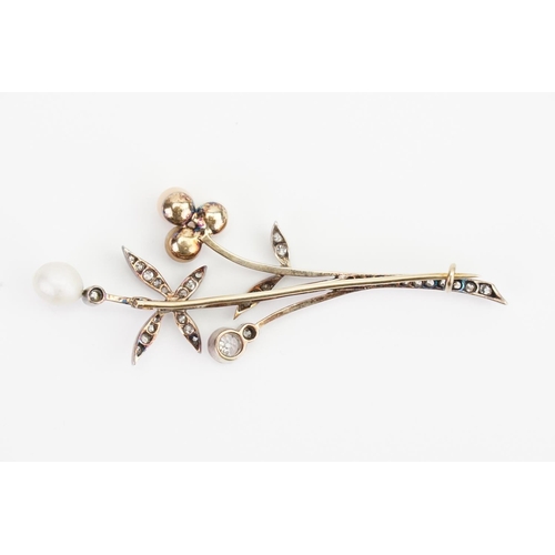 148 - A 9ct Gold and Silver Topped Diamond Brooch in a Floral design, set with Four Pearls, 35 Diamonds, L... 