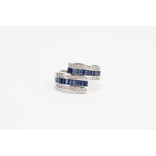 139 - A 14ct White Gold Diamond and Sapphire Ring, set with 20 Sapphires (Largest 0.05ct). Size R. Weight ... 