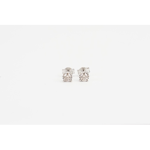 173 - A Pair of 9ct White Gold Solitaire Diamond Earrings. Diamond size: 0.3ct. Weight: 1.2 grams.