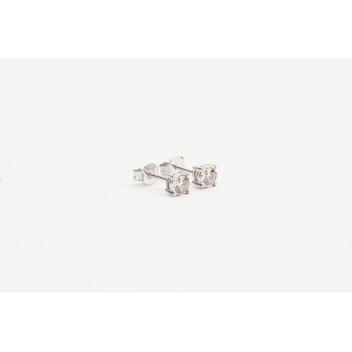 173 - A Pair of 9ct White Gold Solitaire Diamond Earrings. Diamond size: 0.3ct. Weight: 1.2 grams.