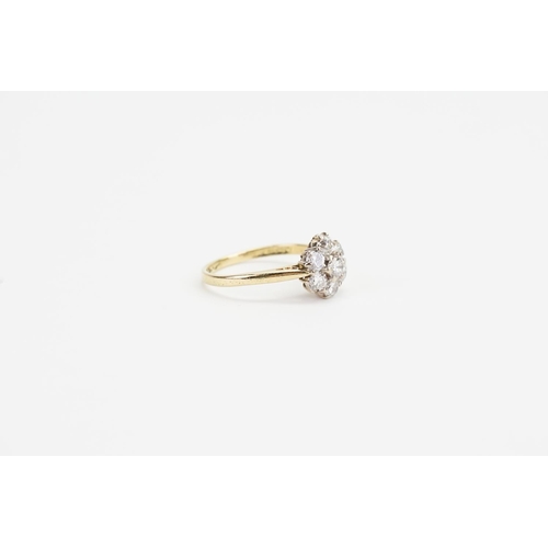 140 - An 18ct Gold Diamond Cluster Ring, set with 7 Diamonds in the daisy form. Largest Diamond: 0.15ct.We... 