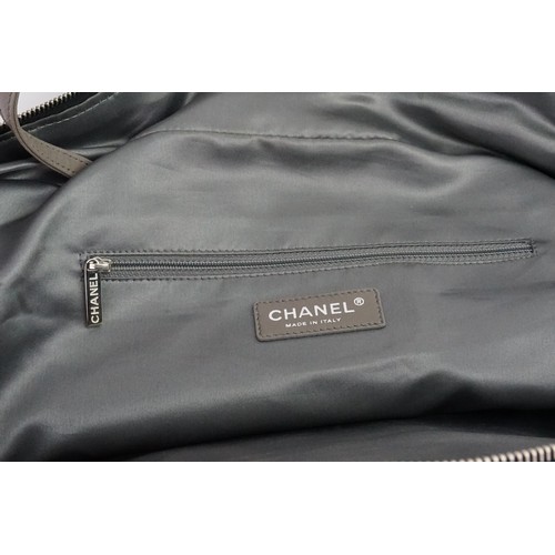 273 - A Chanel Pocket in the City Travel Bag Caviar Large, in black caviar leather. Dual flat leather hand... 