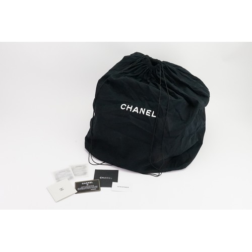 273 - A Chanel Pocket in the City Travel Bag Caviar Large, in black caviar leather. Dual flat leather hand... 