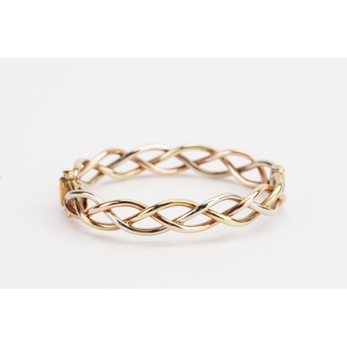 172 - A 9ct Tri-Gold Bangle. Weighing: 19.3 grams. Wrist Diameter: 53mms approx.