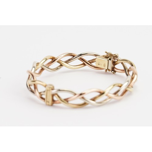 172 - A 9ct Tri-Gold Bangle. Weighing: 19.3 grams. Wrist Diameter: 53mms approx.