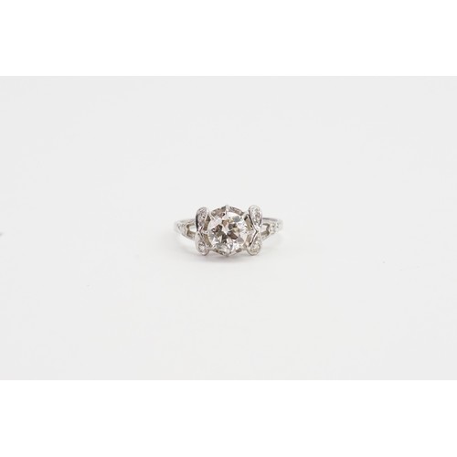 169 - An Art Deco designed Solitaire Diamond Ring in a Platinum setting. Main Diamond Approx 1.3ct. 6 Shou... 