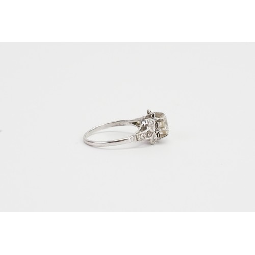 169 - An Art Deco designed Solitaire Diamond Ring in a Platinum setting. Main Diamond Approx 1.3ct. 6 Shou... 