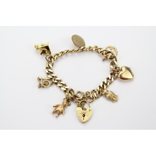 115 - A lovely 9ct Gold Charm Bracelet set with various charms including, an old man, teddy, heart, etc. T... 