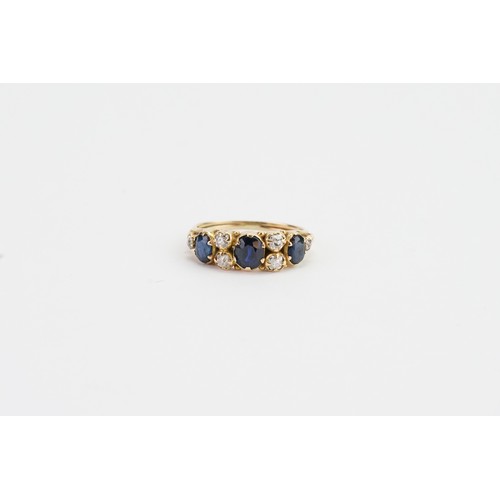 163 - A Ladies Antique Gold diamond and sapphire dress ring with six diamonds and three sapphires. size k.