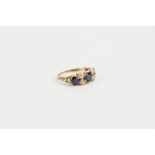 163 - A Ladies Antique Gold diamond and sapphire dress ring with six diamonds and three sapphires. size k.