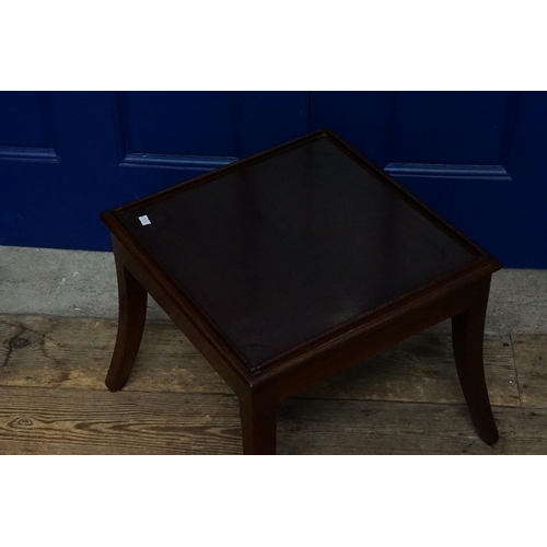 605 - A Mahogany Stool with Swept out Legs and a Squab Cushion.