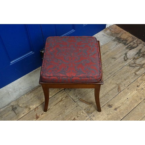 605 - A Mahogany Stool with Swept out Legs and a Squab Cushion.