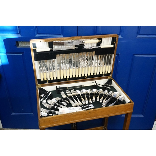 47 - A Canteen of Cutlery in a Wooden Case on Legs.