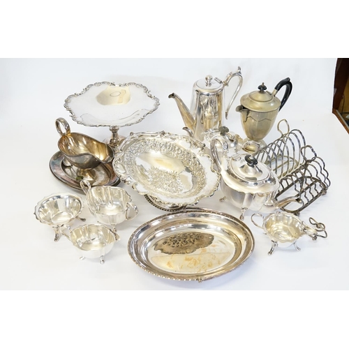 68 - A Silver Plated Cake Basket, a Silver Plated Tea set, a gravy boat, a sugar bowl, a toast rack and o... 